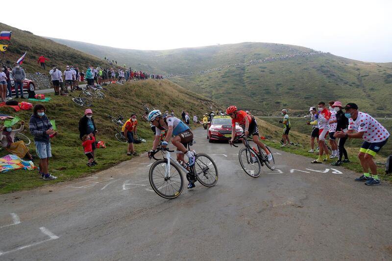 France's Nans Peters, left, and Ilnur Zakarin of Russia climb Port de Bales pass during Stage 8. AP