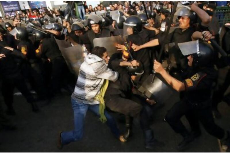 Demonstrators clash with police on January 25 in central Cairo during a protest to demand the departure of President Hosni Mubarak and calling for reforms, the start of two and a half weeks of uproar.