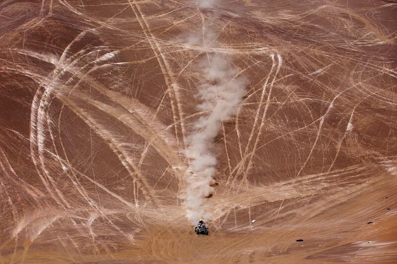 Honda Mec Team’s Walter Nosiglia of Bolivia races in Stage 9 of the 2014 Dakar Rally on January 14, 2014 in Iquique, Chile. Dean Mouhtaropoulos / Getty Images