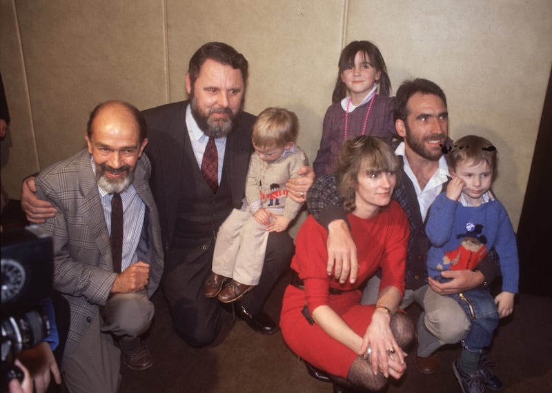 Terry Waite at Gatwick Airport with released hostage Robin Plummer and his family in 1985. Plummer's release from Libya was negotiated by Waite