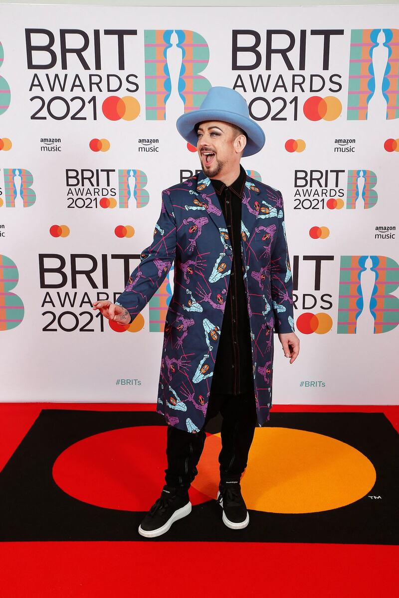 Boy George walks the Brits 2021 red carpet in his signature baby blue fedora. Reuters