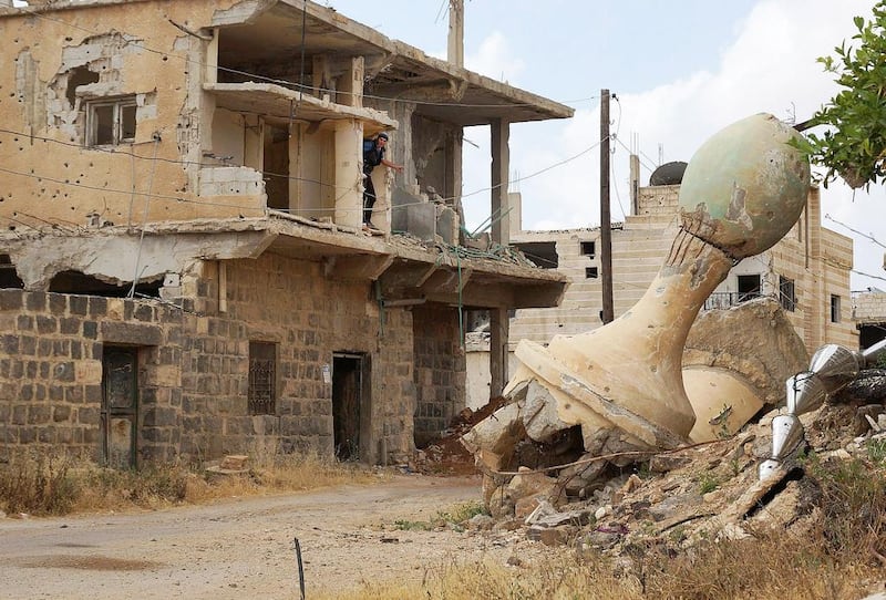 Moderate commanders admitted there was limited popular appeal to the fight against ISIL affiliates in Deraa province. A damaged minaret of a mosque is pictured in the  provincial capital, also called Deraa, on Tuesday. Alaa Al Faqir/Reuters