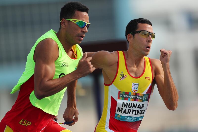 Joan Munar Martinez, right, of Spain in action during the Men's 400m T12. EPA