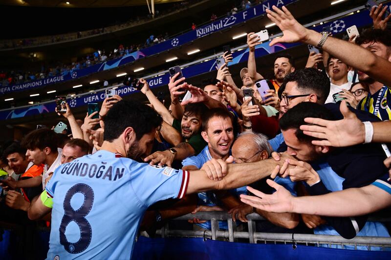 Manchester City's German midfielder #8 Ilkay Gundogan celebrates with the fans after winning the UEFA Champions League final football match between Inter Milan and Manchester City at the Ataturk Olympic Stadium in Istanbul. AFP