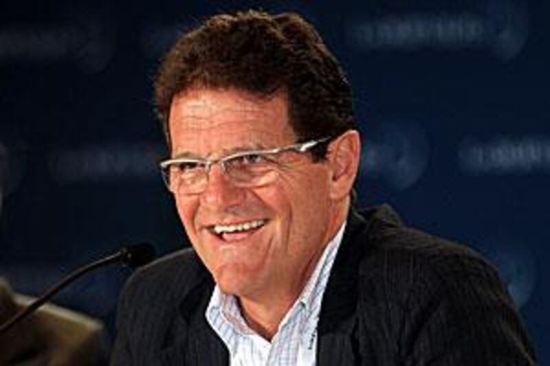 England manager, Fabio Capello tells the media at the Emirates Palace hotel that he would not swap his position with Italy manager Marcello Lippi.