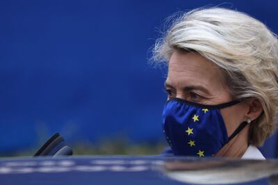 European Commission President Ursula von der Leyen leaves a round table meeting during an EU summit at the European Council building in Brussels, on December 11, 2020. EU leaders agreed after a long night of wrangling to set a more ambitious target of cutting greenhouse gas emissions by 55 percent by 2030. / AFP / POOL / Kenzo Tribouillard
