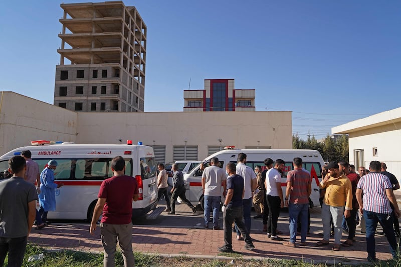 People gather outside a hospital in Zakho after Turkey shelled a mountain resort in Iraq's Kurdistan region. AFP