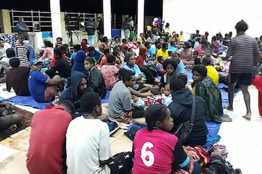 A handout made available by Indonesia's National Disaster Management Agency (BNPB) shows residents gathering at a temporary shelter as flash flood affect the area in Sentani, near Jayapura, Papua province, Indonesia, 17 March 2019. EPA