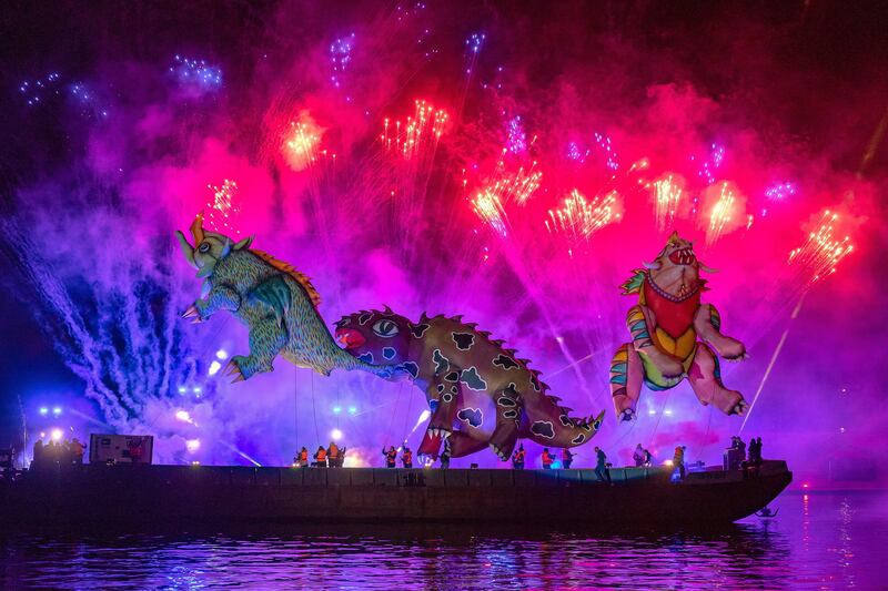 Giant dragons float down the Vistula River during the Great Dragon Show in Krakow. EPA