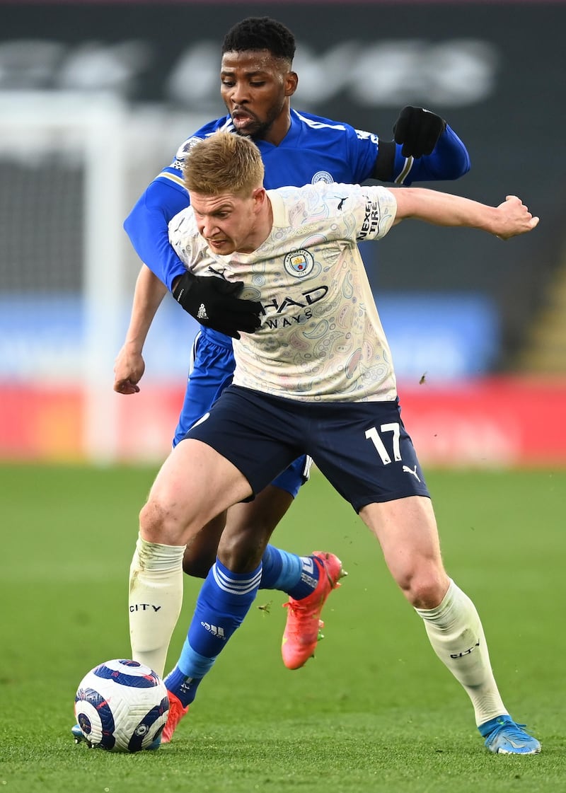 Kevin De Bruyne of Manchester City holds off Kelechi Iheanacho of Leicester City. Getty