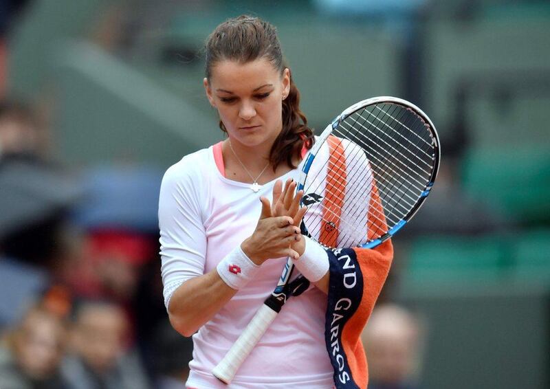 Poland's Agnieszka Radwanska reacts during her women's fourth round match against Bulgaria's Tsvetana Pironkova. Philippe Lopez / AFP