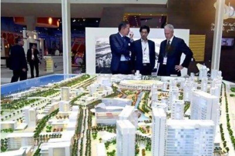TDIC is master developer of the Saadiyat Island development. Above, visitors look at models of planned projects in the island.