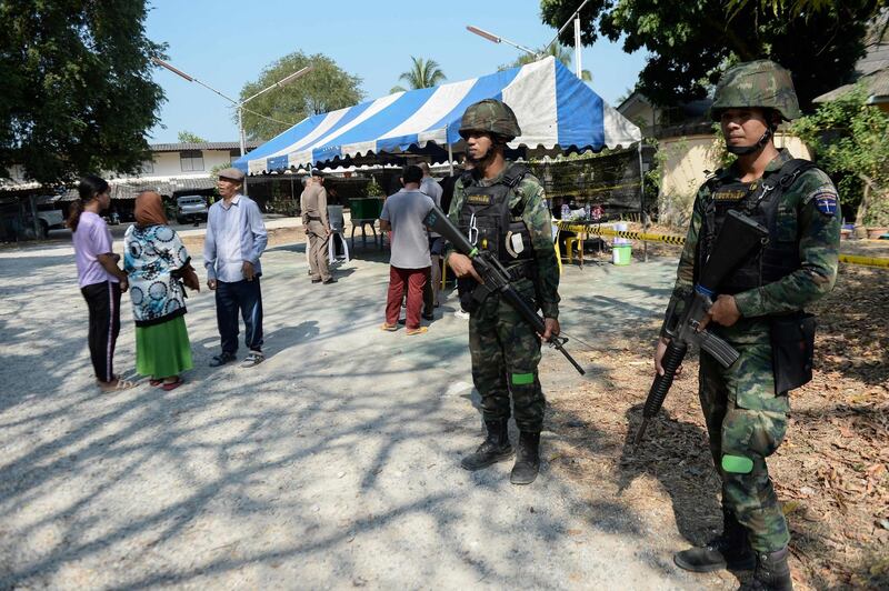 Thai soldiers stand guard near a polling station in Narathiwat. AFP