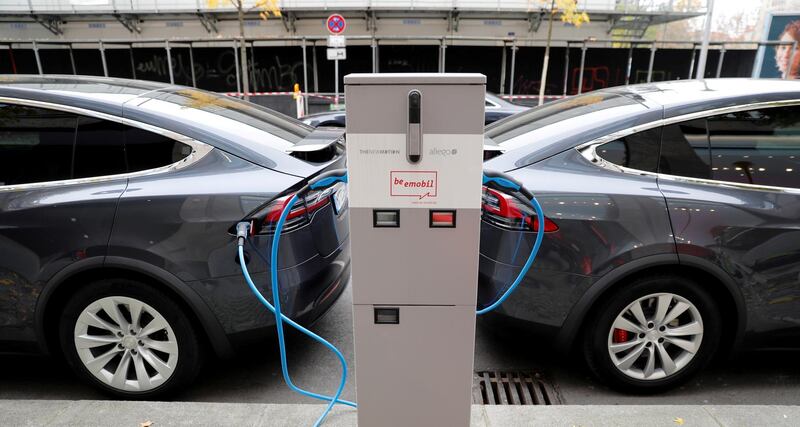 FILE PHOTO: FILE PHOTO: Tesla Model X electric cars recharge their batteries in Berlin, Germany, November 13, 2019.    REUTERS/Fabrizio Bensch/File Photo