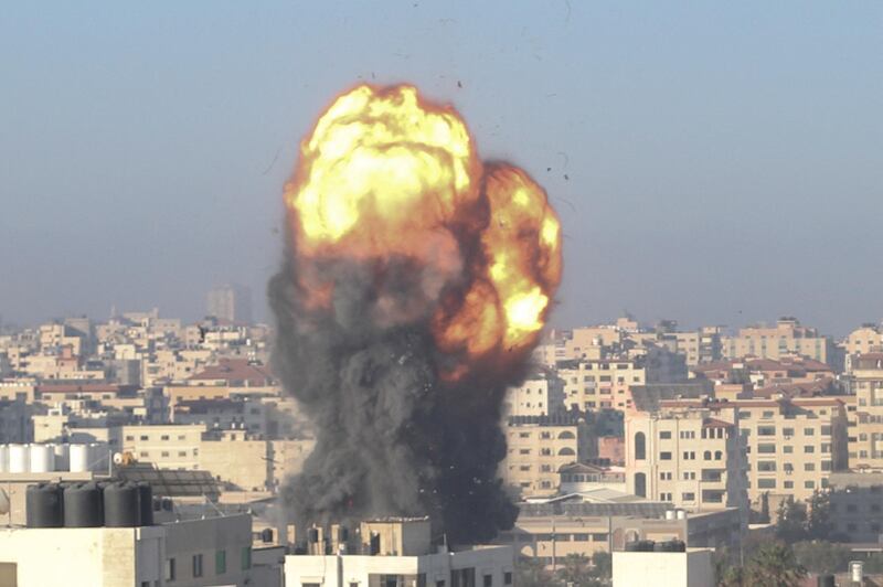 A fireball and smoke billow up into the air during an Israeli air strike on Gaza City targeting the Ansar compound, linked to the Hamas movement, in the Gaza Strip. AFP