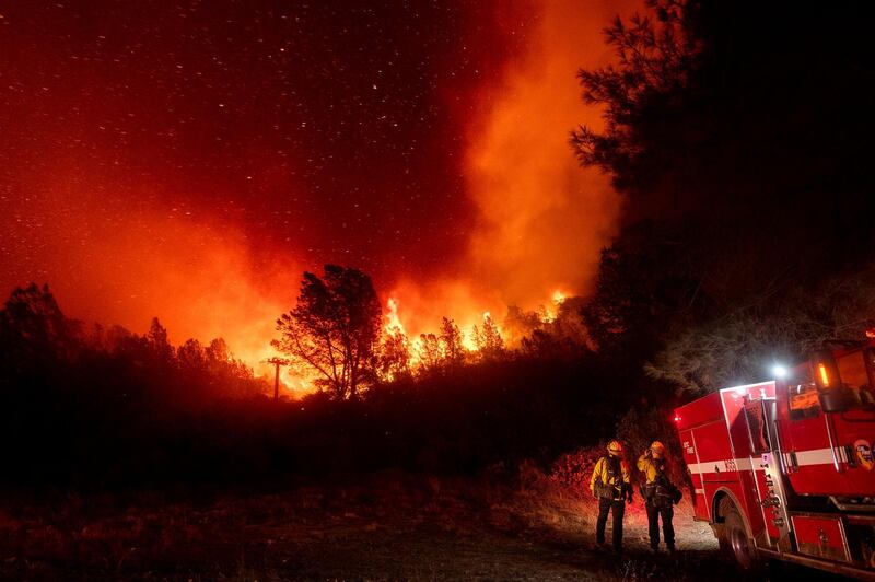 Firefighters watch the Bear Fire approach in Oroville, California. AP Photo
