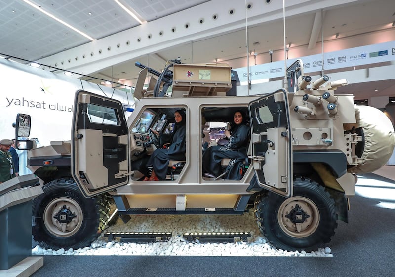 Abu Dhabi, U.A.E., February 20, 2019. INTERNATIONAL DEFENCE EXHIBITION AND CONFERENCE  2019 (IDEX) Day 4--  Lady visitors sit inside the Ajban 440 A Protected Vehicle.
Victor Besa/The National
Section:  NA