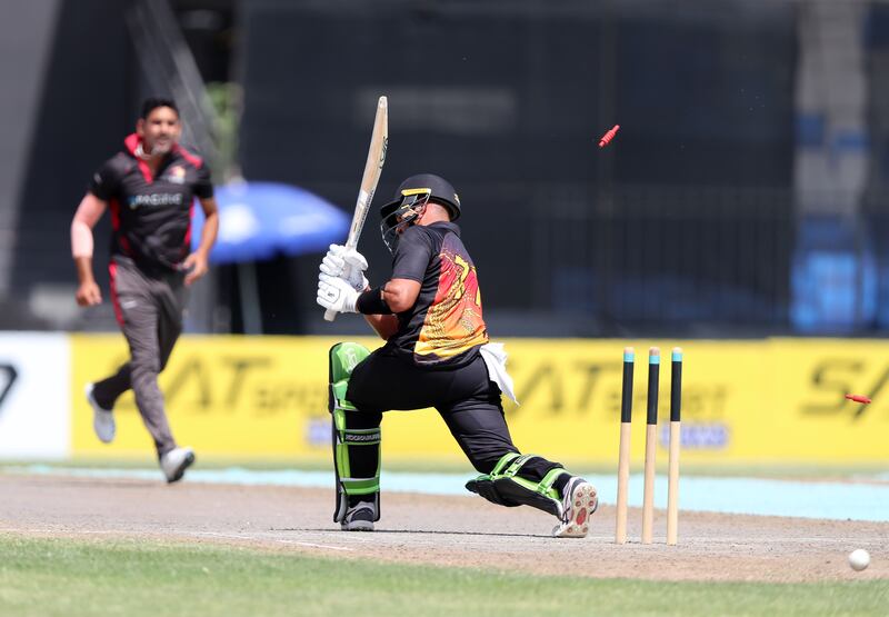 The UAE's Zahoor Khan bowls PNG's Chad Soper in Sharjah.