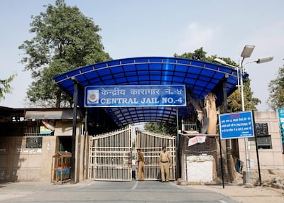 Police stand guard at one of the gates of the Tihar Jail in New Delhi March 11, 2013. The driver of the bus in which a young Indian woman was gang-raped and fatally injured in December hanged himself in his jail cell on Monday, prison authorities said, but his family and lawyer said they suspected "foul play". Ram Singh, the main accused in India's most high-profile criminal case, killed himself in a cell he shared with three other inmates in New Delhi's Tihar jail just before dawn, prison spokesman Sunil Gupta said. REUTERS/Mansi Thapliyal (INDIA - Tags: CRIME LAW MILITARY)