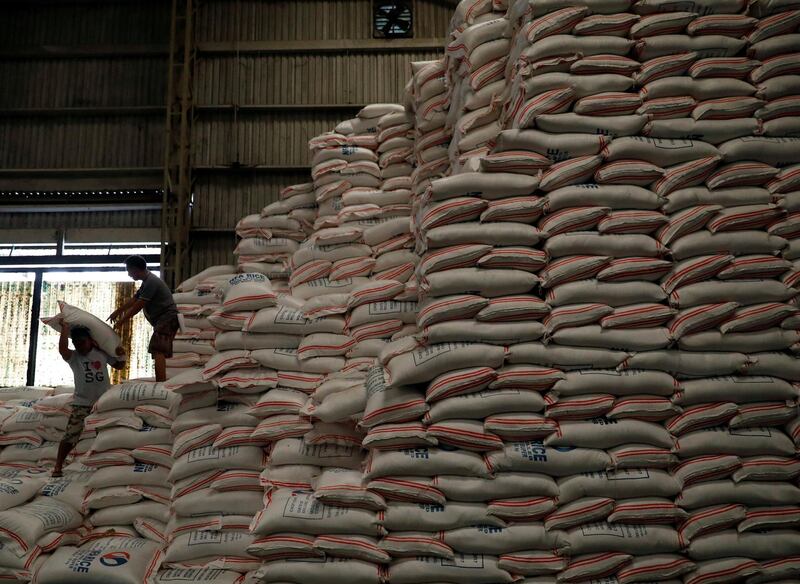 Workers load a sack of rice in a warehouse in Quezon city, metro Manila, Philippines. Dondi Tawatao / Reuters