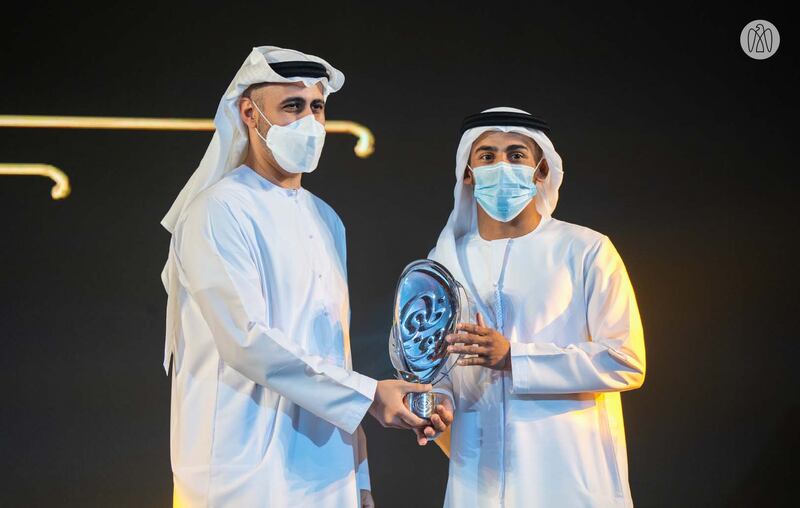 Sheikh Theyab bin Mohamed, Member of the Executive Council, presents the Asian Jiu-Jitsu Player of the Year Award to Zayed Al Katheeri. Photo: Abu Dhabi Government Media Office