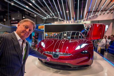 Henrik Fisker, founder, Chairman and CEO of Fisker Inc., speaks next to a Fisker EMotion all-electric vehicle that uses LiDAR technology at CES in Las Vegas, Nevada, January 9, 2018. / AFP PHOTO / DAVID MCNEW