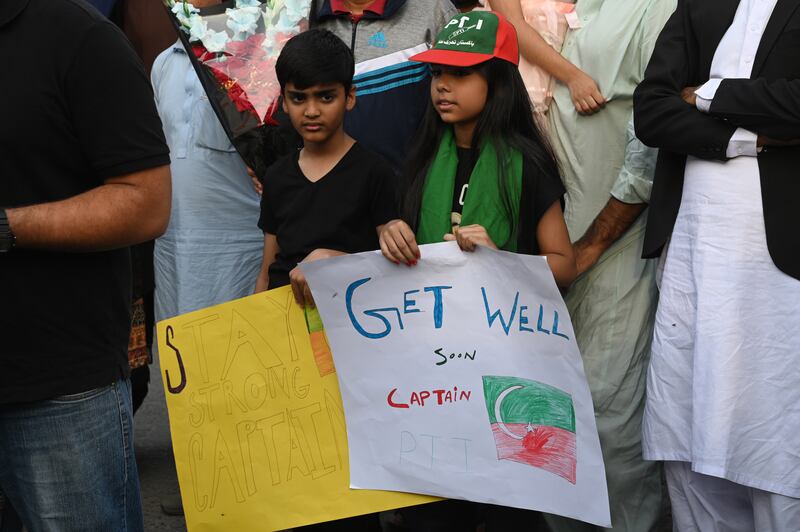 Supporters of Mr Khan, the current head of the Pakistan Tehrik-e-Insaf political party, gather outside the hospital as the former prime minister was discharged. Mr Khan has said that the party's long march to Islamabad, the capital, will resume on Tuesday. EPA