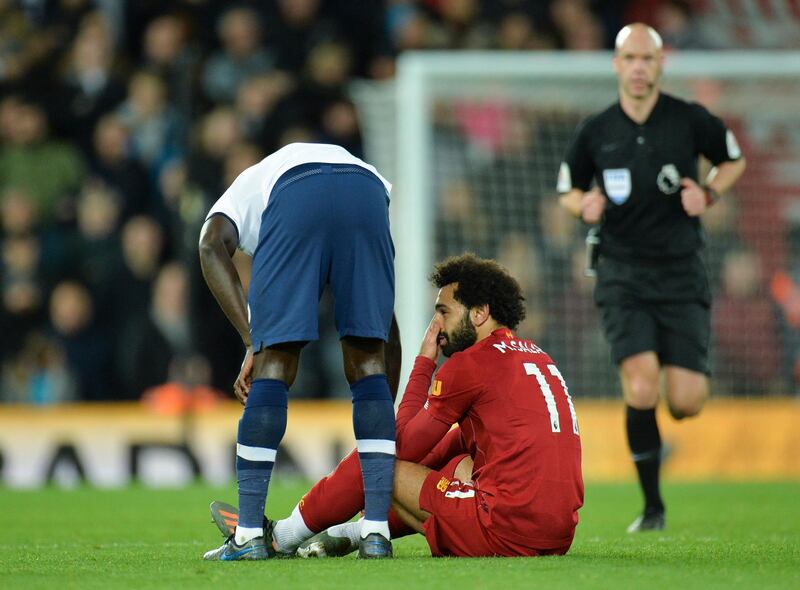 epa07954478 Liverpoolâ€™s Mohamed Salah (C) reacts during the English Premier League game between Liverpool FC and Tottenham Hotspur in Liverpool, Britain, 27 October 2019.  EPA/PETER POWELL EDITORIAL USE ONLY. No use with unauthorized audio, video, data, fixture lists, club/league logos or 'live' services. Online in-match use limited to 120 images, no video emulation. No use in betting, games or single club/league/player publications.