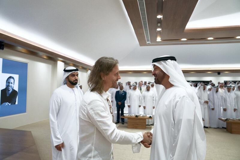 ABU DHABI, UNITED ARAB EMIRATES - May 13, 2019: HH Sheikh Mohamed bin Zayed Al Nahyan, Crown Prince of Abu Dhabi and Deputy Supreme Commander of the UAE Armed Forces (R), greets Dr Beau Lotto (L) primo to his lecture titled 'The Science of Innovation: Becoming Naturally Adaptable', at Majls Mohamed bin Zayed. 

( Eissa Al Hammadi / Ministry of Presidential Affairs )
---