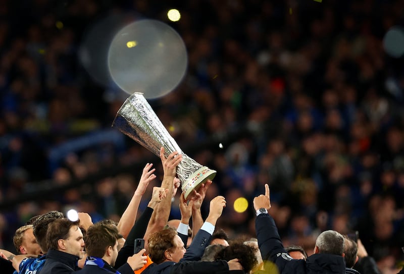Atalanta's Berat Djimsiti lifts the trophy after Atalanta's victory in the Europa League final. Reuters