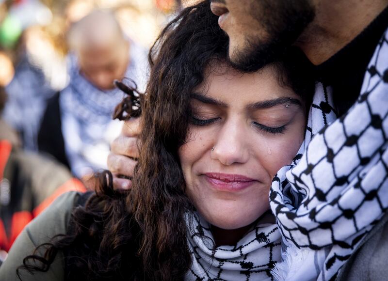 People embrace during a demonstration in solidarity with the Palestinian population, in The Hague. EPA