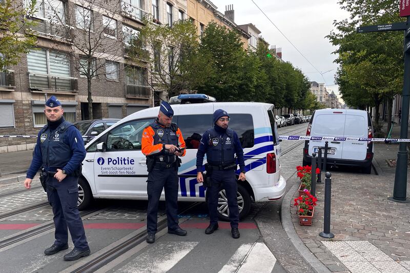 Police seal off an area in Schaerbeek near Brussels. A suspected gunman who allegedly shot dead two Swedish football fans in Belgium in what authorities said was a terrorist attack was then shot dead by police. Reuters
