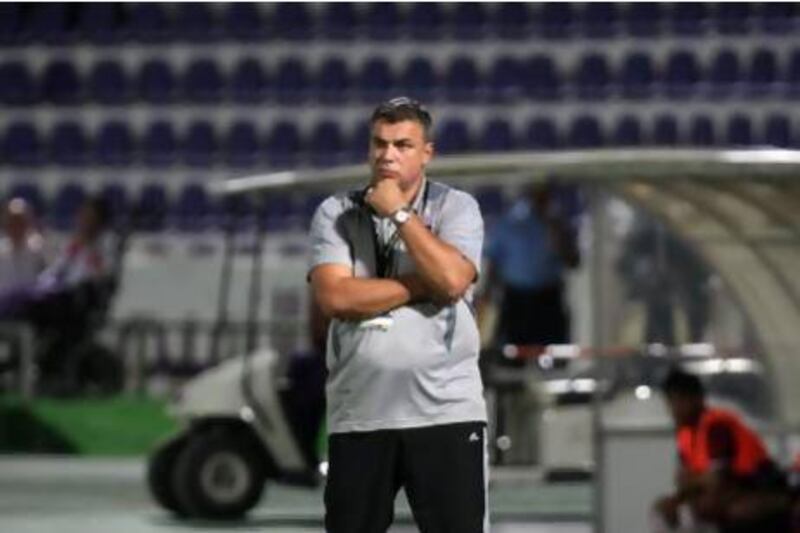 AL AIN , UNITED ARAB EMIRATES - Oct 14 : Cosmin Olaroiu , Coach of Al Ain during the Etisalat Cup round 3 football match between Al Wahda vs Al Ain at Tahnoun Bin Mohammed Stadium in Al Ain. ( Pawan Singh / The National )