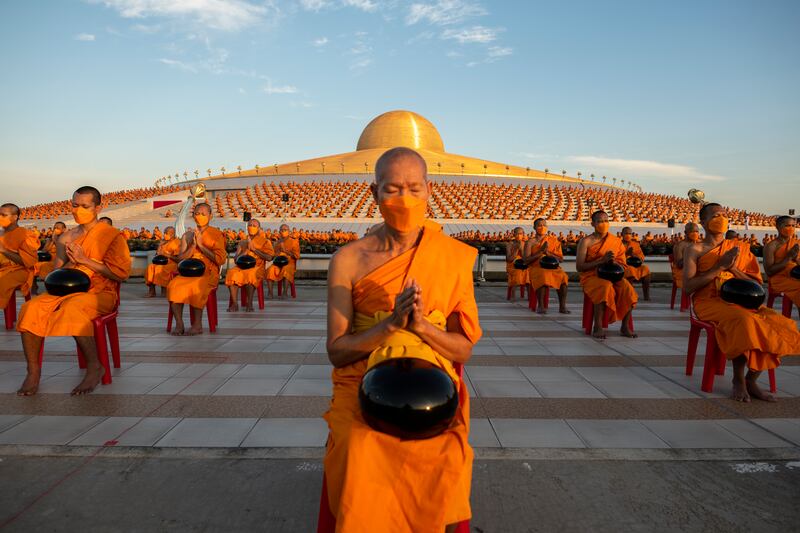 Three thousand Buddhist monks attend a mass alms giving ceremony for the new year at Wat Phra Dhammakaya Buddhist Temple in Thailand. Getty