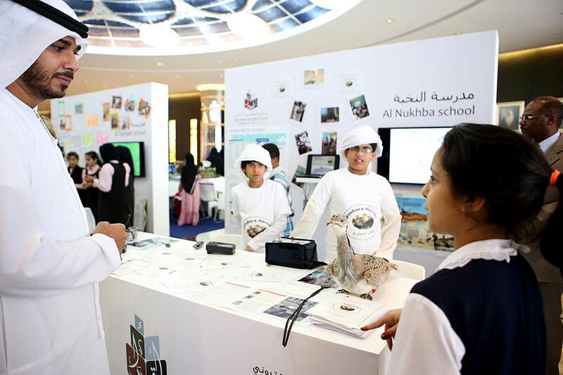 Pupils from Al Nukhba School show off the results of their computer-mapping project at an event at Etihad Towers on June 8, 2014. Fatima Al Marzooqi / The National 