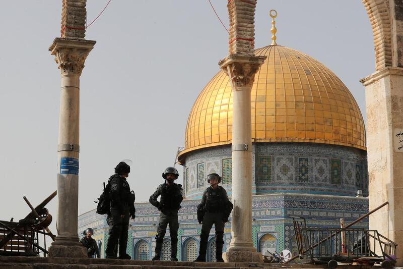 Israeli police stand in front of the Dome of the Rock during clashes with Palestinians at the compound that houses Al Aqsa Mosque. Reuters