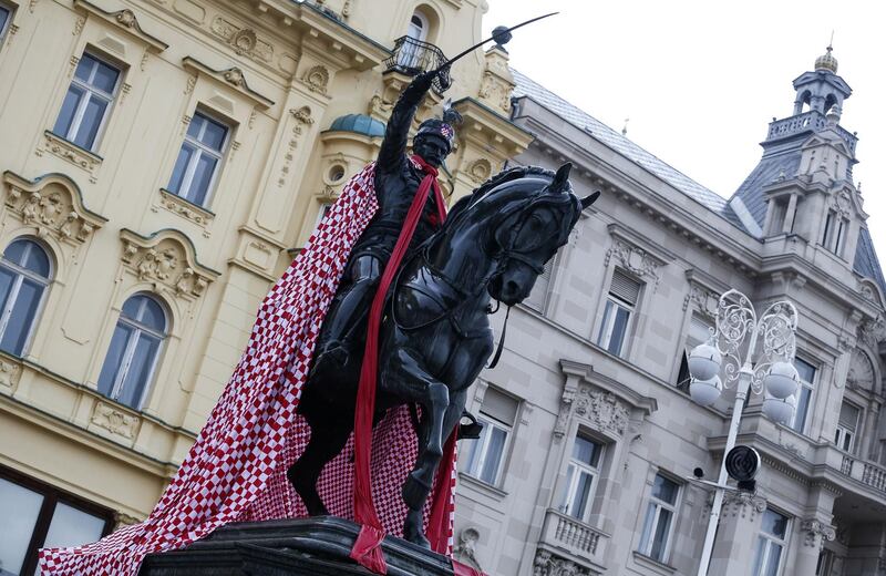A statue monument of the 19th-century rebel nobleman Ban Jelacic is covered with Croatian national colours in Zagreb. Getty Images