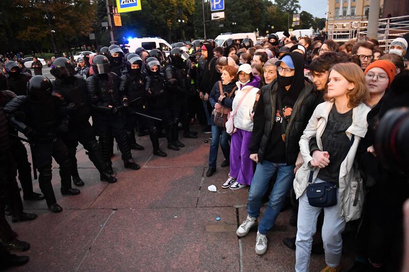 Police and protesters confront each other in Saint Petersburg. AFP