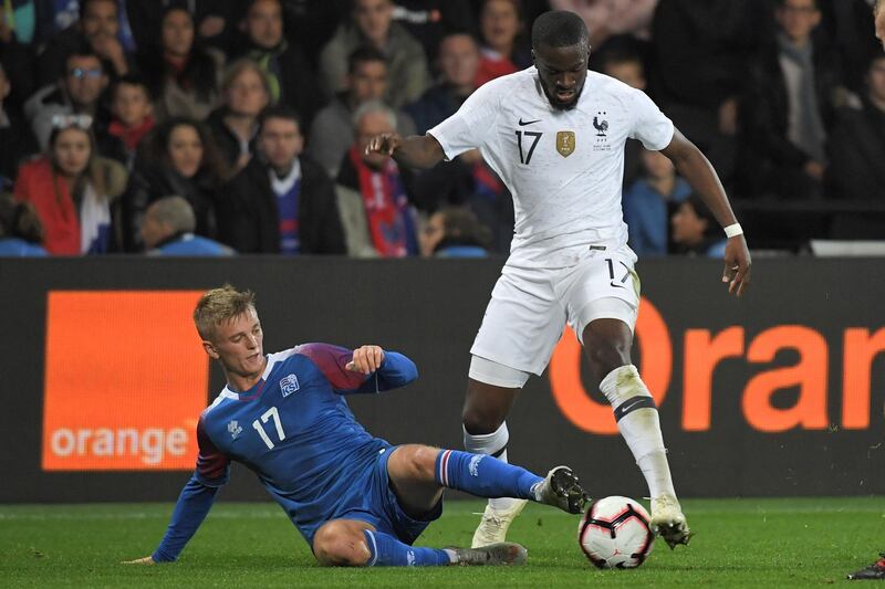 Iceland's forward Albert Gudmundsson (L) vies with France's midfielder Tanguy Ndombele during the friendly football match between France and Iceland at the Roudourou stadium in Guingamp, western France. AFP
