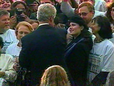 In this image taken from video, Monica Lewinsky (wearing beret) watches President Clinton as he greets White House staff members on the South Lawn of the White House on Nov. 6, 1996, during a victory celebration after his re-election. (AP Photo/APTV)