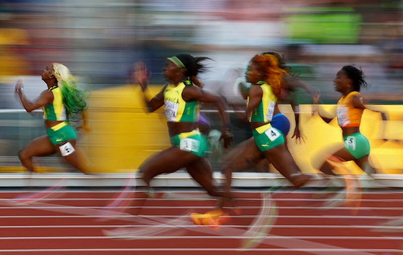 Shelly-Ann Fraser-Pryce, Shericka Jackson and Elaine Thompson-Herah during the women's 100m final. Reuters