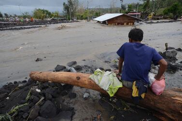 A man looks as floodwaters inundate an area as Typhoon Goni hit Daraga, Albay province, central Philippines. AP