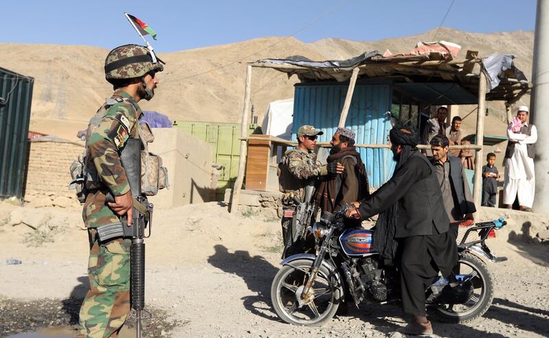 epa06814604 Afghan national army officers search alleged Taliban fighters during a three-day ceasefire on second day of Eid al-Fitr, in the outskirt of Kabul, Afghanistan, 16 June 2018.  Earlier in the month, President Ghani's government had announced a temporary ceasefire, starting on 12 June, to last until the end of the festival. The Taliban had followed suit a few days later and announced a three-day partial ceasefire during the festival.  EPA/JAWAD JALALI