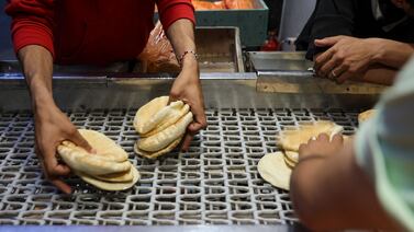 Flatbread at a bakery in Gaza city. Bakers are among those who have fled south to Rafah, starting up their businesses there. AFP