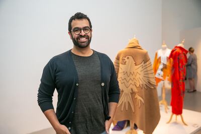 Khalid Mezaina stands infront of his work at Tashkeel's The Alumni Return. He has graduated with a master's degree in textile design from Rhode Island School of Design. Tashkeel