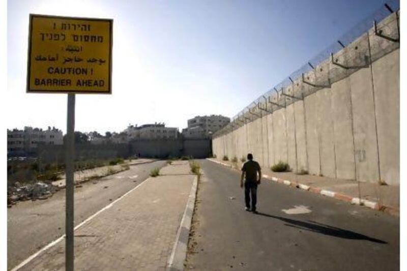 A concrete barrier separates the West Bank from Jerusalem at Beit Hanina in Israeli-annexed East Jerusalem.