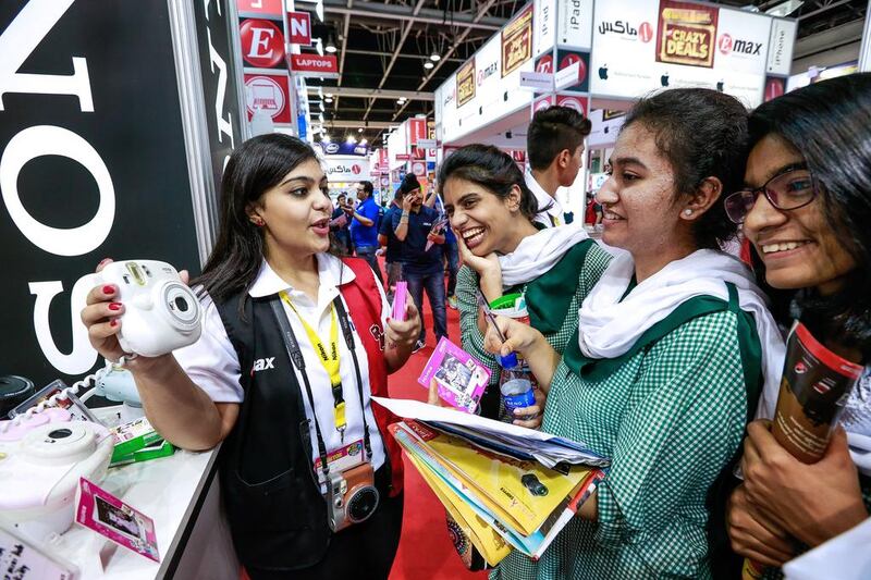 Dubai students about to purchase a polaroid camera at Gitex Shoppers Fall 2015. Victor Besa for The National