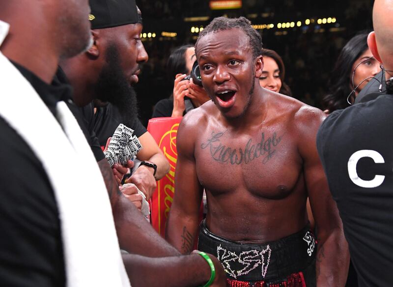 KSI (black/red shorts) reacts after it was announced he defeated Logan Paul. AFP