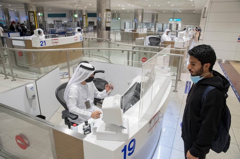 Passengers arrive at Dubai Airport Terminal 3. The UAE is introducing new visa rules from September 5, 2022. Antonie Robertson / The National
