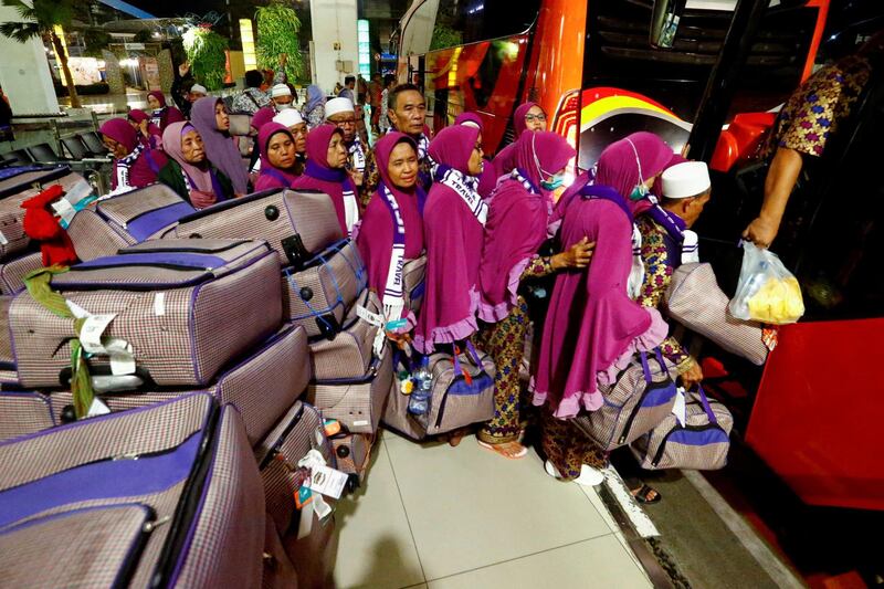 Umrah pilgrims leave after the cancellation of the departure to Mecca following the Saudi government's temporary ban announced on Thursday to keep the country safe because of coronavirus outbreak, at Soekarno Hatta International Airport, Tangerang, near Jakarta, Indonesia. REUTERS